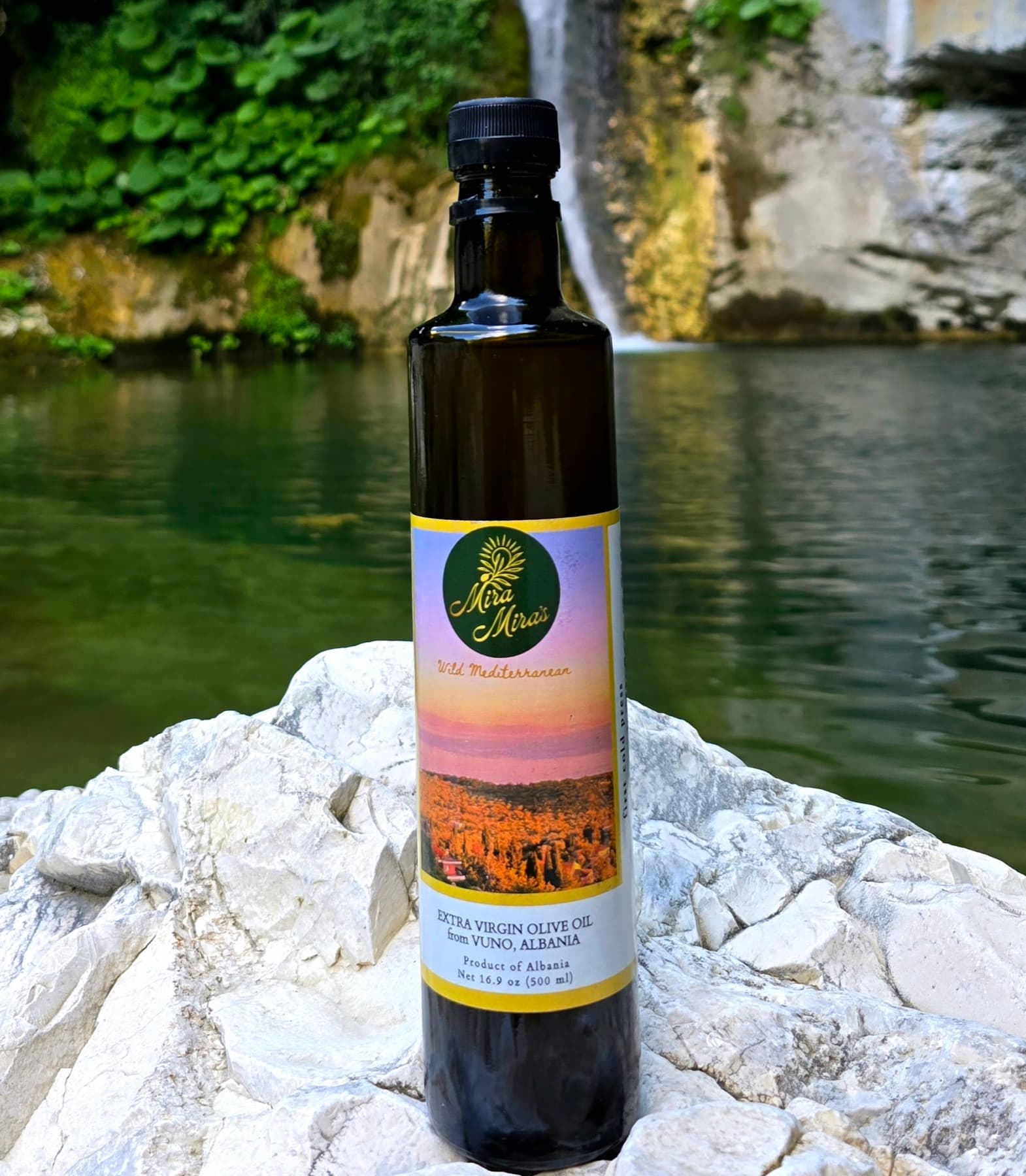 Vuno extra virgin olive oil bottle in a natural Albanian landscape
