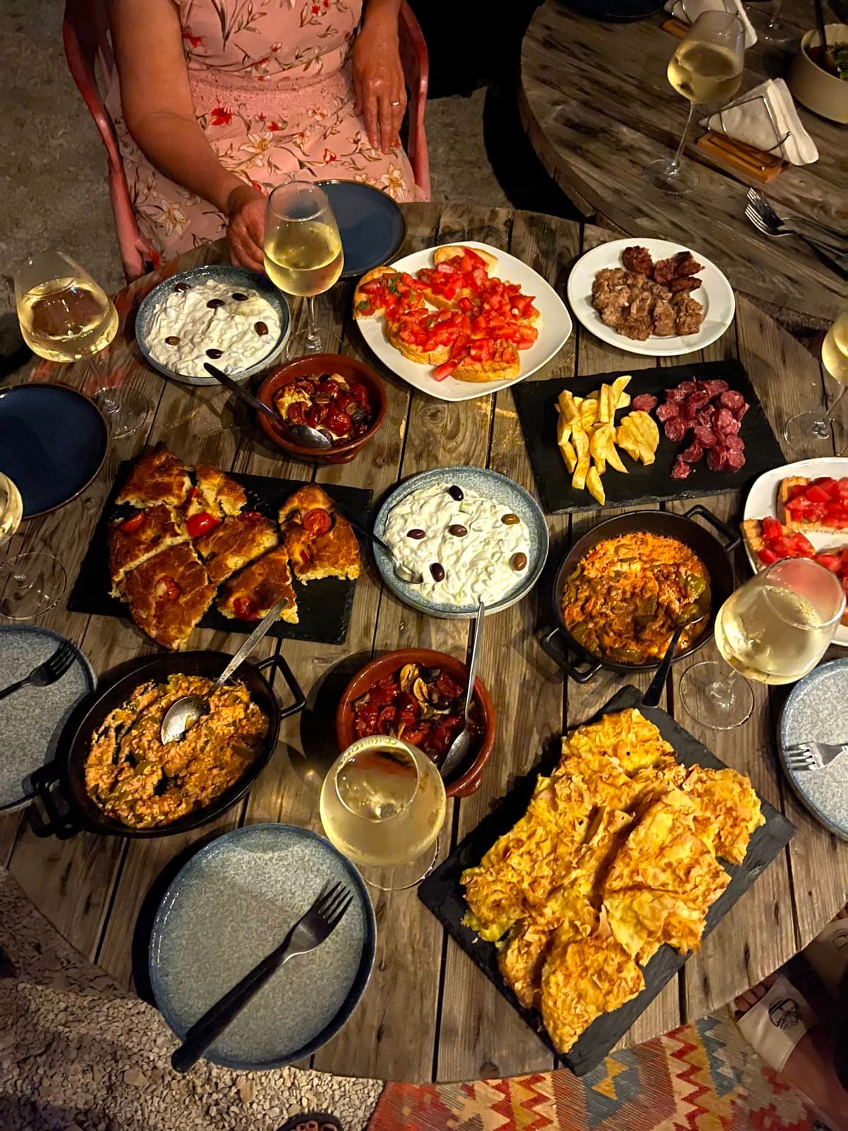 Shared Mediterranean table with several dishes for tasting Vuno olive oil