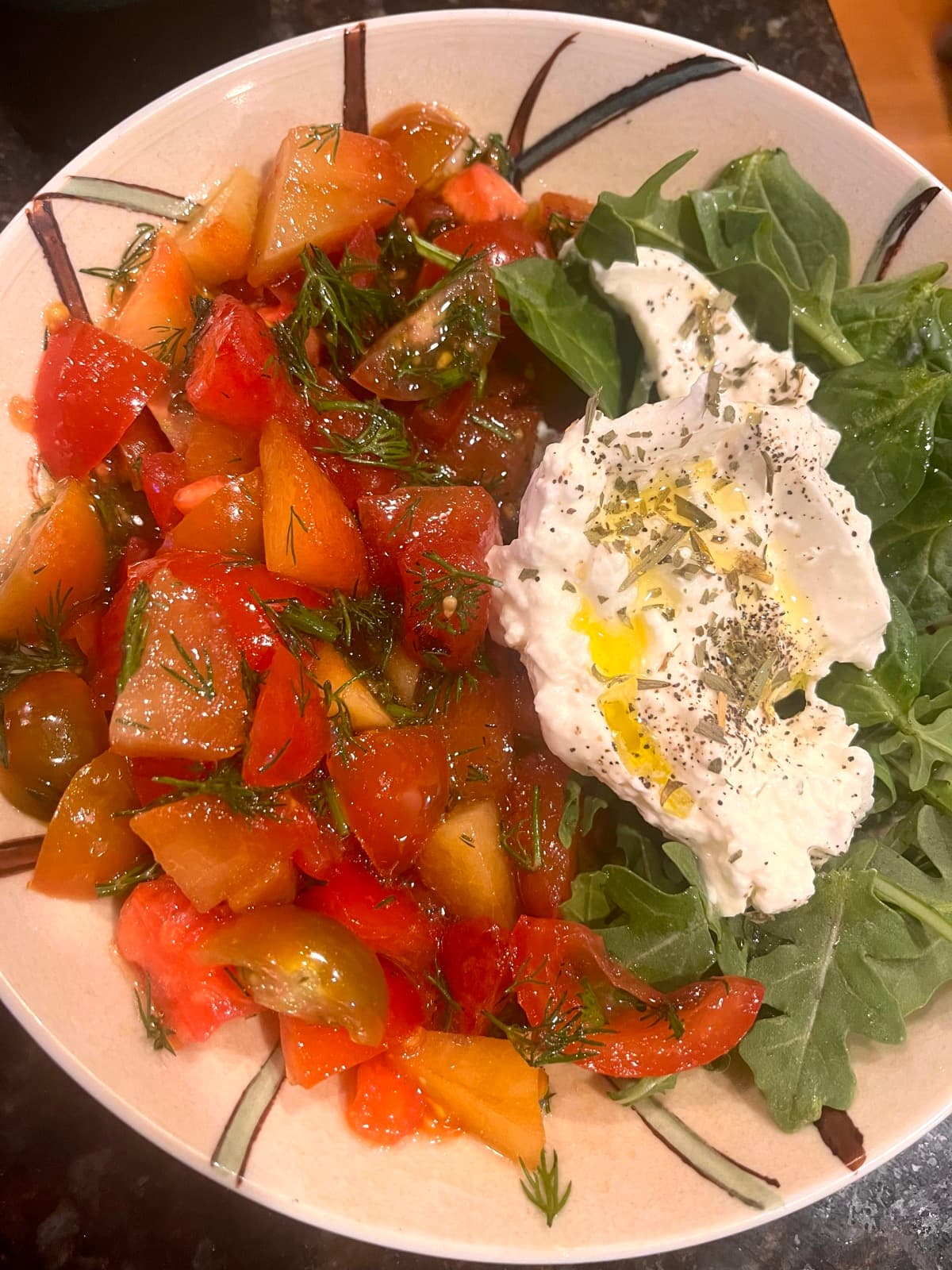 Tomatoes and burrata finished with Vuno olive oil